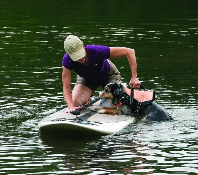 paddleboarding with a dog