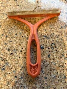The PetPals Furbolish is a small brush that does well in tight spots.